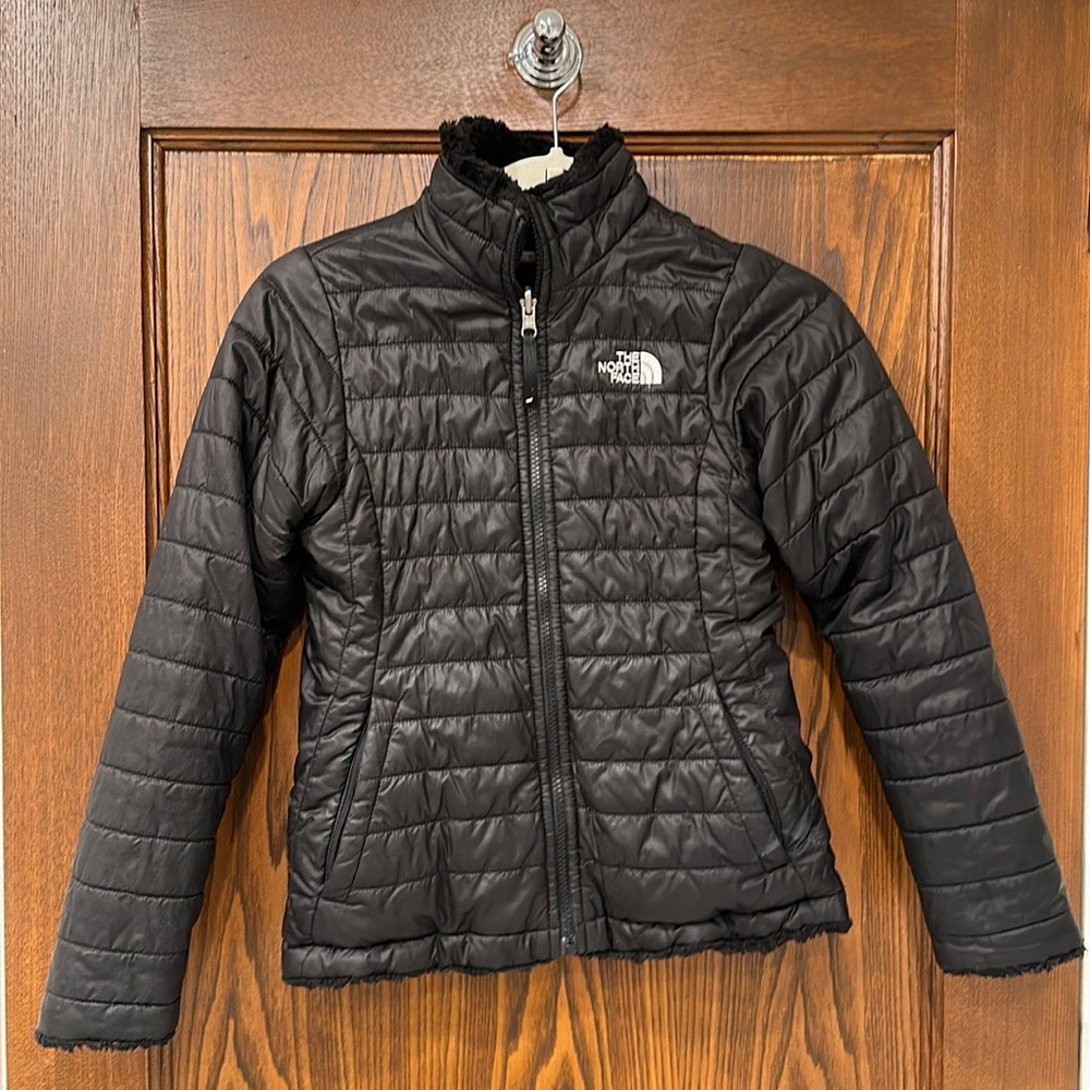 The North Face girls black reversible Mossbud jacket.